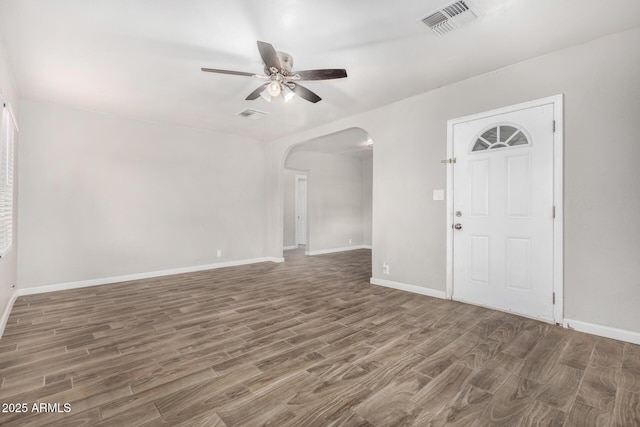 foyer featuring ceiling fan and dark hardwood / wood-style floors