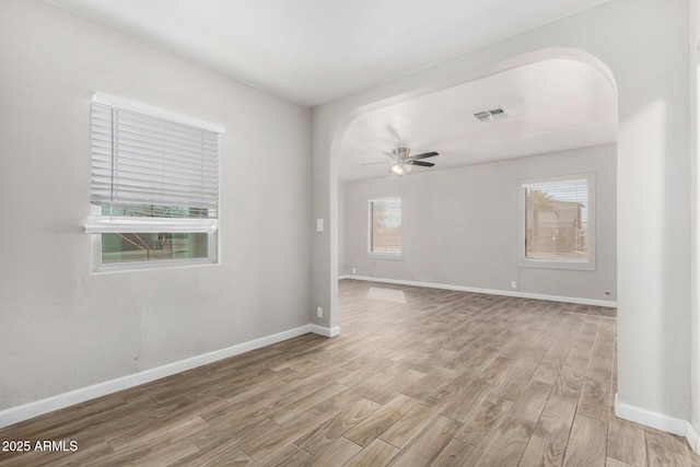 empty room featuring ceiling fan and light hardwood / wood-style floors