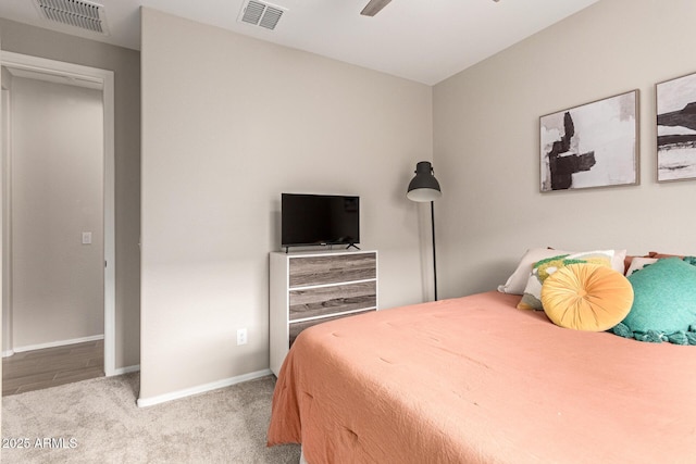 bedroom featuring baseboards, visible vents, carpet floors, and ceiling fan