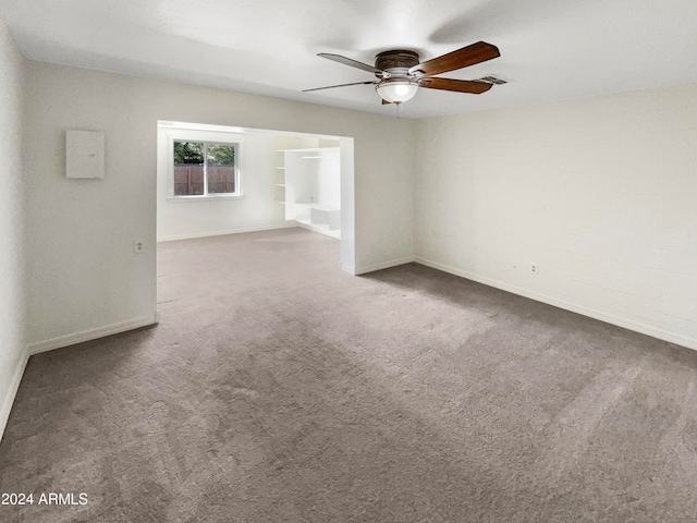 unfurnished room featuring carpet floors and ceiling fan