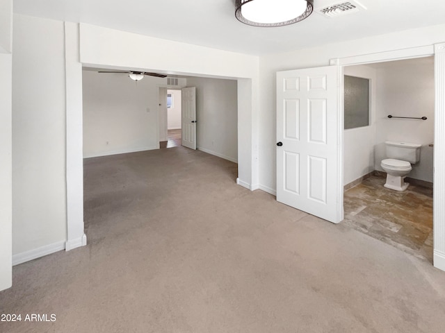 interior space featuring ceiling fan and light colored carpet