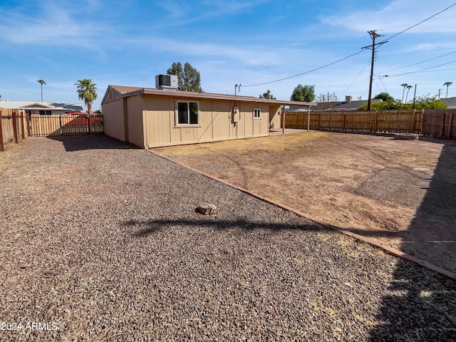 back of house featuring a patio and central air condition unit