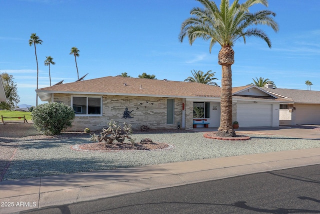 ranch-style home featuring a garage