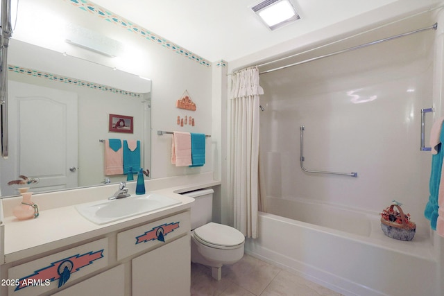 full bathroom featuring shower / bath combo with shower curtain, tile patterned floors, vanity, and toilet