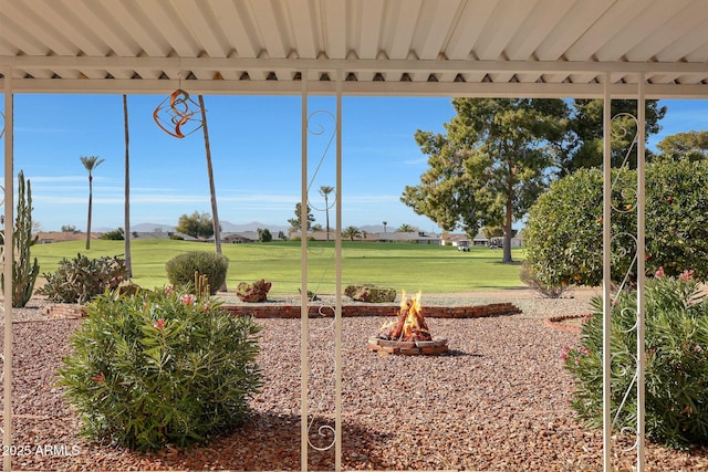 view of yard with an outdoor fire pit