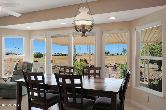 dining space with tile patterned flooring and a healthy amount of sunlight