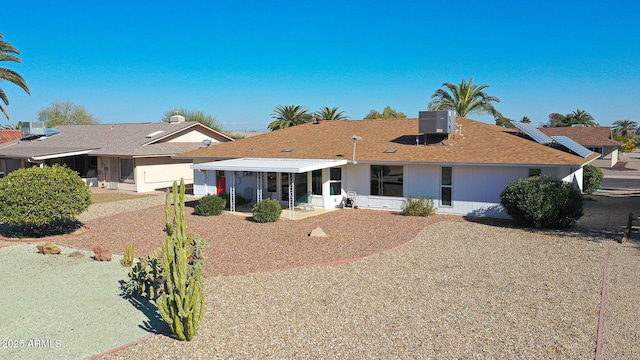 ranch-style house featuring a patio area and central air condition unit