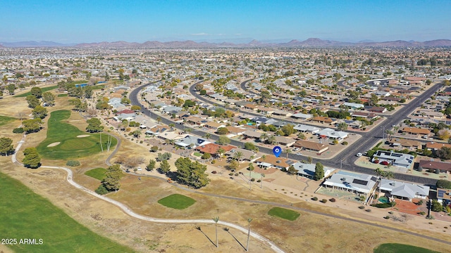 birds eye view of property with a mountain view