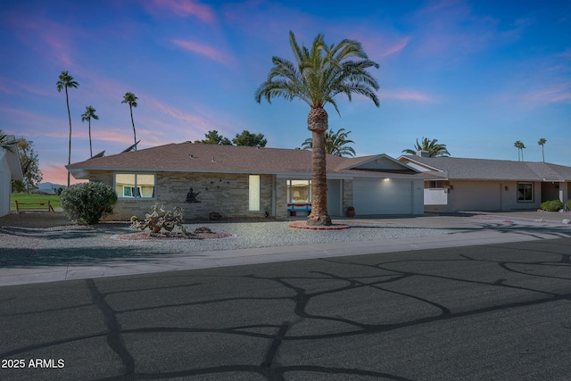 ranch-style home featuring a garage