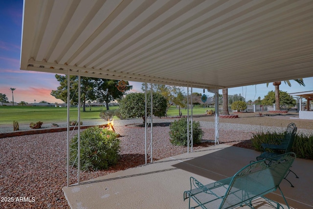 patio terrace at dusk with a yard