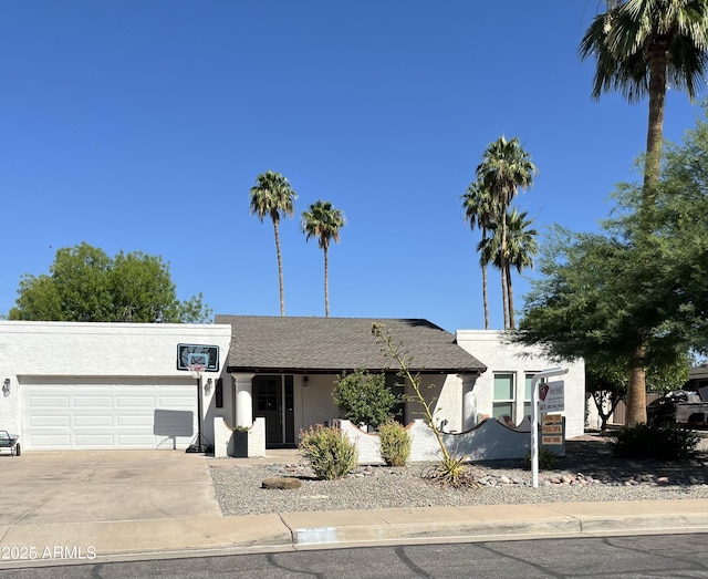 1452 E Gary St, Mesa, AZ 85203 - view of front of home featuring a garage, stucco siding, and driveway
