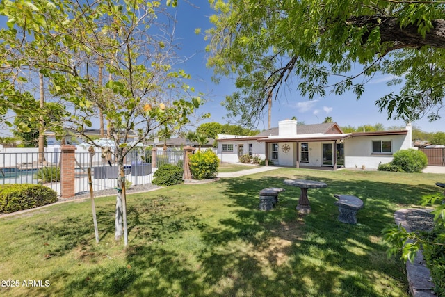 1452 E Gary St, Mesa, AZ 85203 - back of house with stucco siding and a chimney