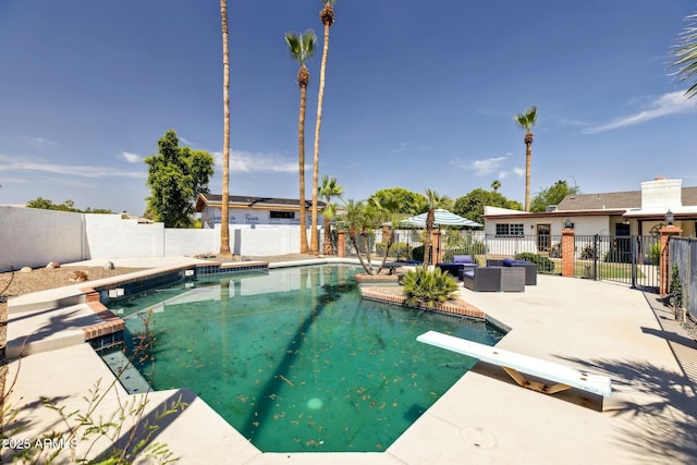 1452 E Gary St, Mesa, AZ 85203 - view of pool with a fenced backyard, a diving board, a patio area, and an outdoor hangout area