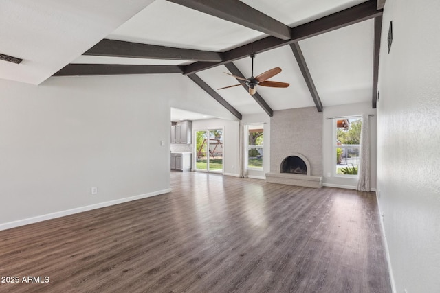 1452 E Gary St, Mesa, AZ 85203 - unfurnished living room featuring a large fireplace, dark wood finished floors, and a ceiling fan