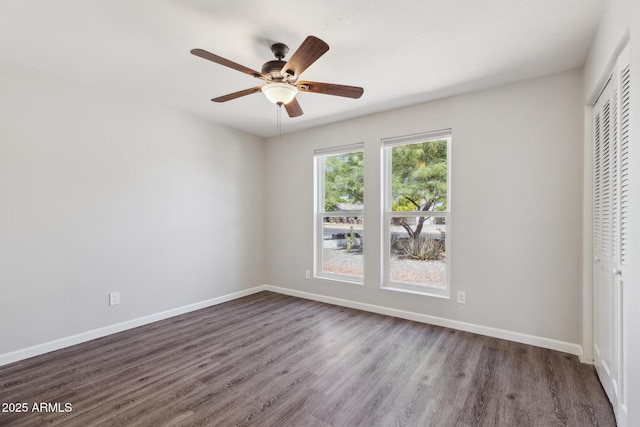1452 E Gary St, Mesa, AZ 85203 - unfurnished bedroom featuring a closet, dark wood-type flooring, and ceiling fan