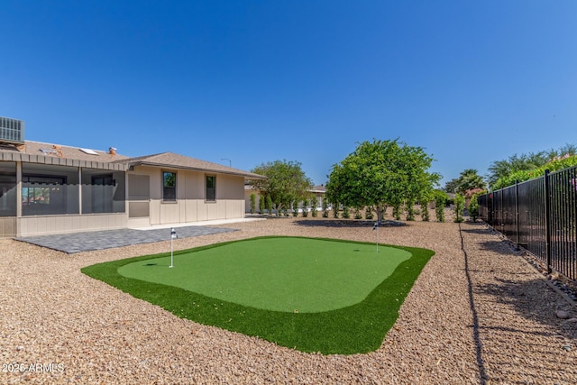 view of yard featuring fence and a patio
