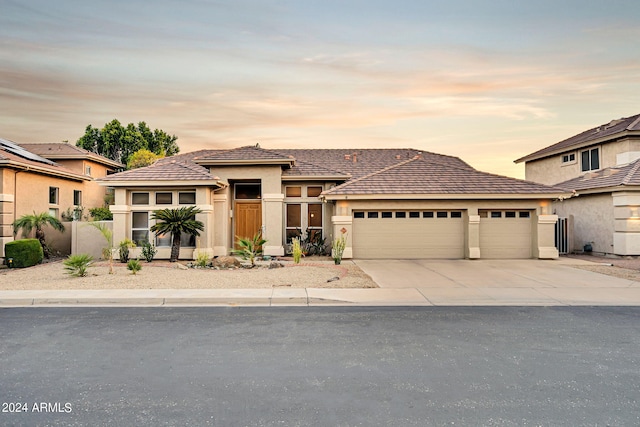 prairie-style house featuring a garage