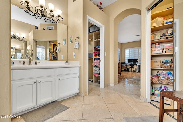 bathroom featuring tile patterned flooring and vanity