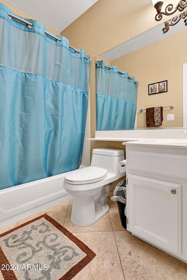 full bathroom featuring toilet, shower / tub combo, tile patterned floors, and vanity