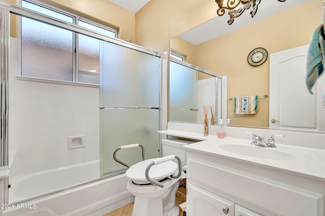 full bathroom featuring toilet, tile patterned flooring, enclosed tub / shower combo, and vanity