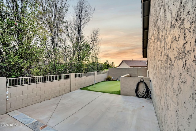 view of patio terrace at dusk