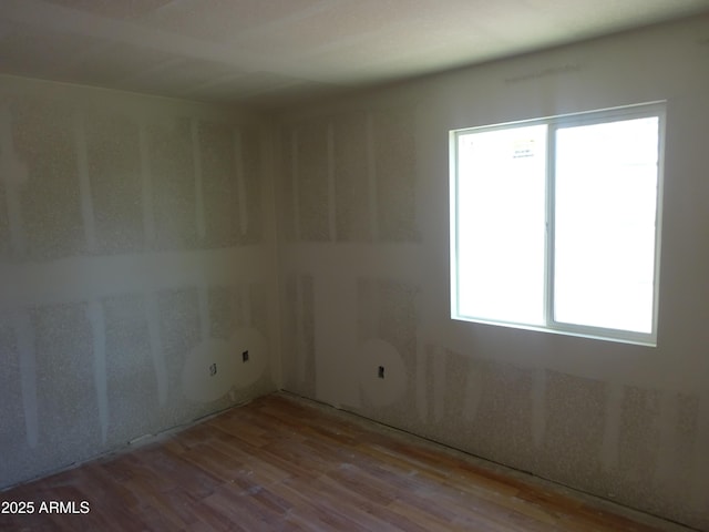 8838 N 8th St Unit 105, Phoenix, AZ 85020 - unfurnished room with wood finished floors and plenty of natural light