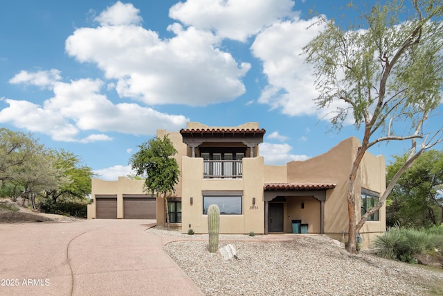 38953 N 57th Pl, Cave Creek, AZ 85331 - view of front of property featuring a balcony, stucco siding, concrete driveway, and a tile roof