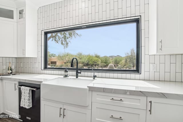 38953 N 57th Pl, Cave Creek, AZ 85331 - kitchen with a sink, tasteful backsplash, white cabinets, and light stone counters