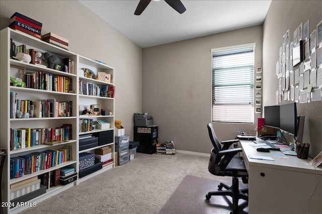 carpeted office featuring ceiling fan