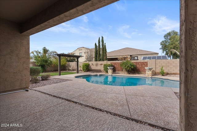 view of pool with a pergola and a patio