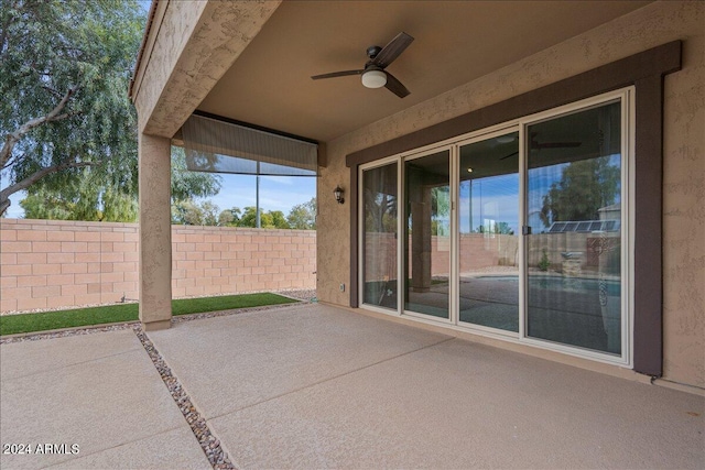 view of patio featuring ceiling fan