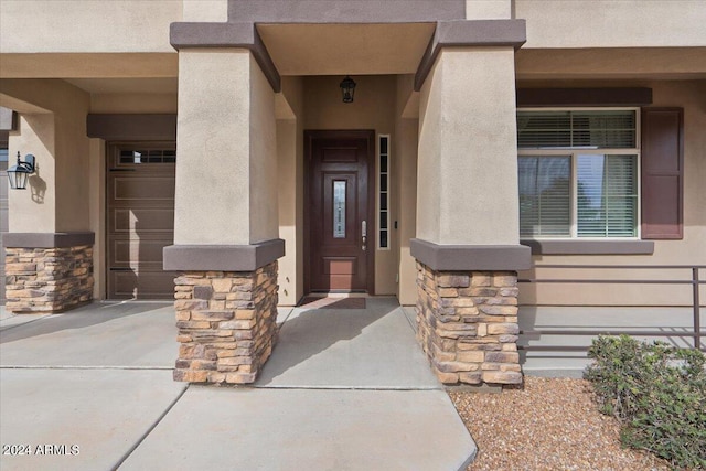 entrance to property featuring a garage