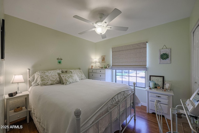 bedroom with ceiling fan and dark hardwood / wood-style floors