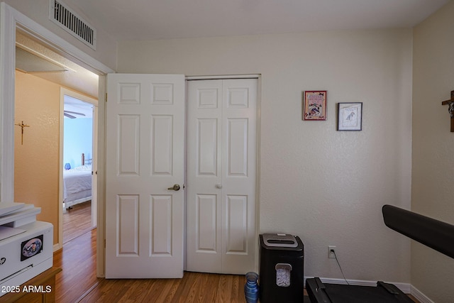 exercise room featuring hardwood / wood-style flooring