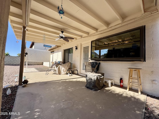 view of patio featuring ceiling fan