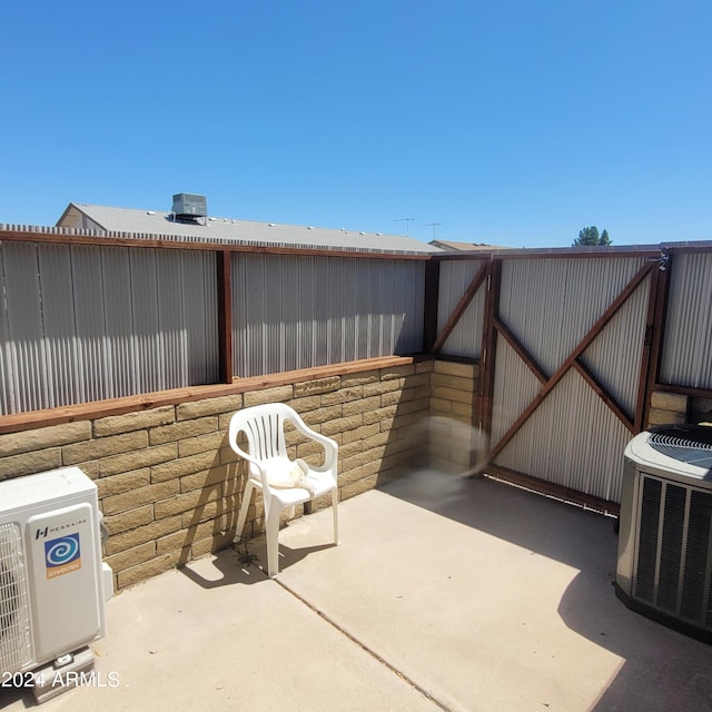 view of patio featuring heating unit and central air condition unit