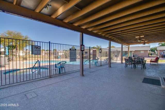 view of patio / terrace with a community pool and ceiling fan