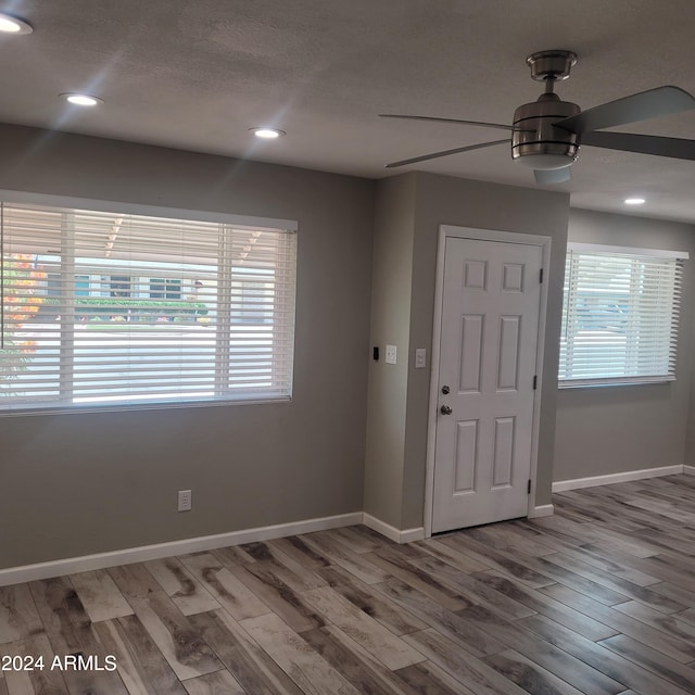 entrance foyer with hardwood / wood-style flooring and ceiling fan