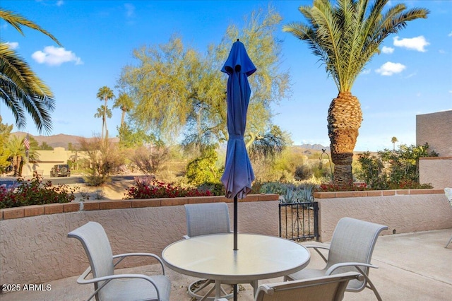 view of patio / terrace with a mountain view