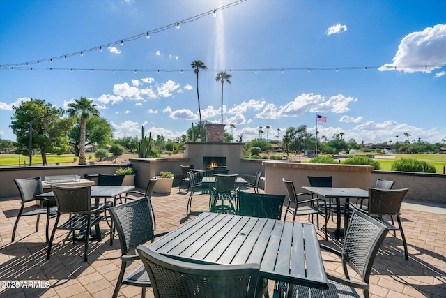 view of patio / terrace with exterior fireplace