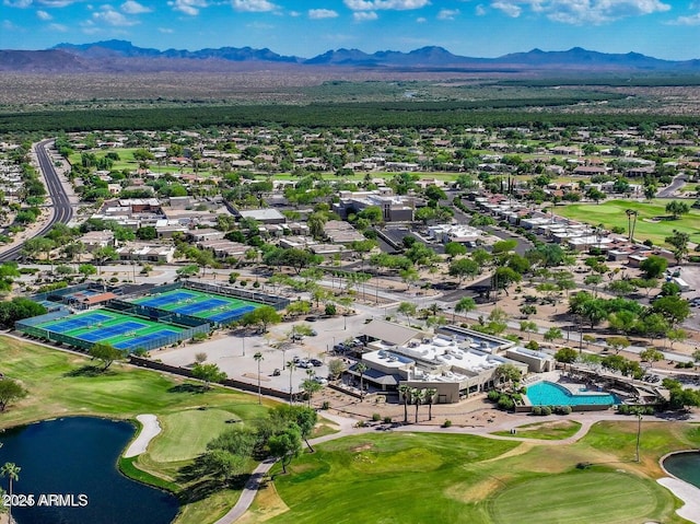 drone / aerial view featuring a water and mountain view