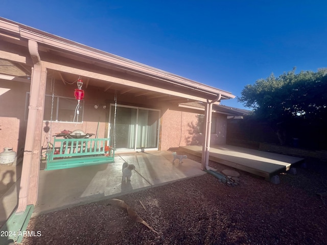 view of side of property with a patio