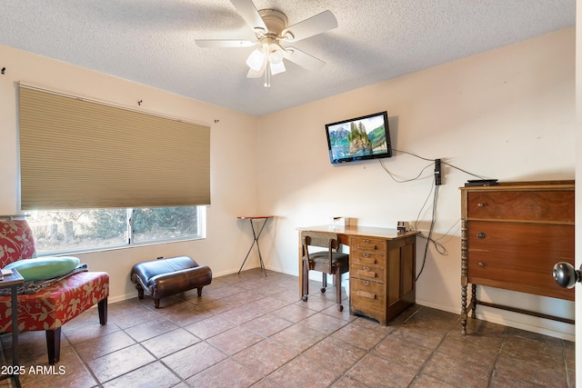 office with ceiling fan and a textured ceiling