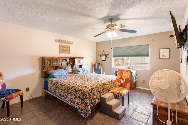 bedroom featuring a textured ceiling and ceiling fan