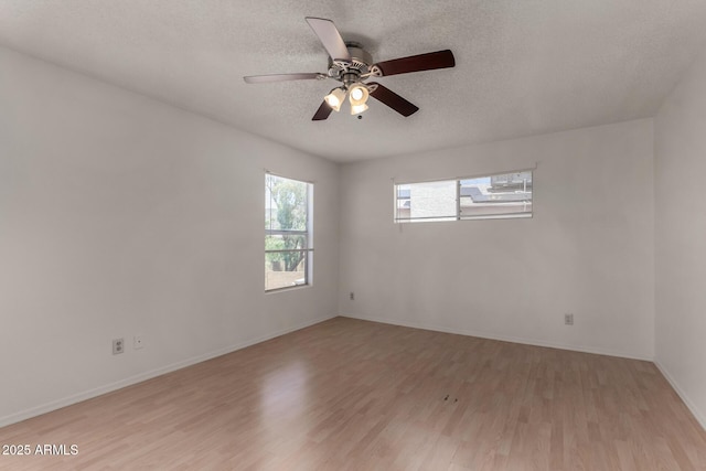 4644 W Havasupai Dr, Glendale, AZ 85308 - spare room with light wood-type flooring, a textured ceiling, and a ceiling fan