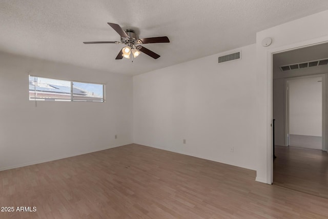 4644 W Havasupai Dr, Glendale, AZ 85308 - spare room featuring light wood-style floors, a ceiling fan, a textured ceiling, and a smoke detector