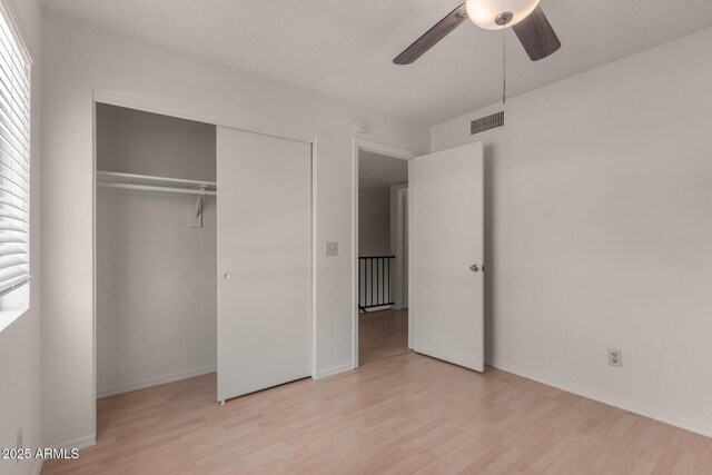 4644 W Havasupai Dr, Glendale, AZ 85308 - unfurnished bedroom with wood finished floors, a closet, and a ceiling fan