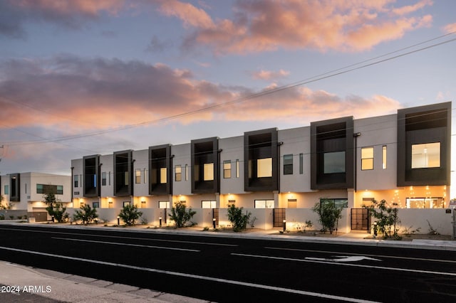 view of outdoor building at dusk