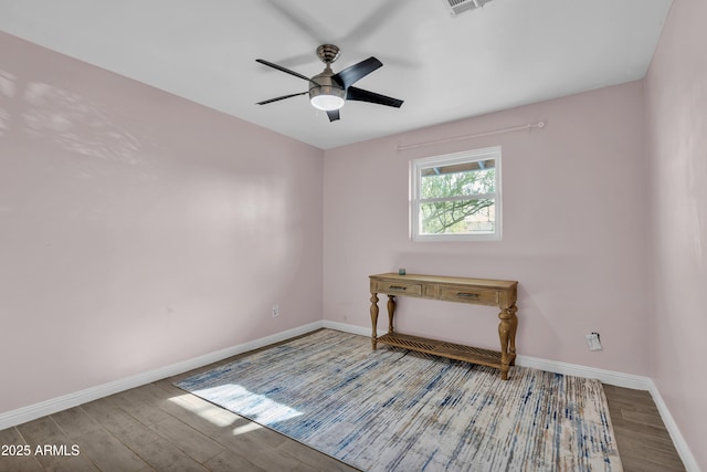 spare room featuring ceiling fan and hardwood / wood-style floors