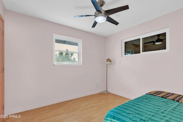 bedroom featuring ceiling fan and light wood-type flooring